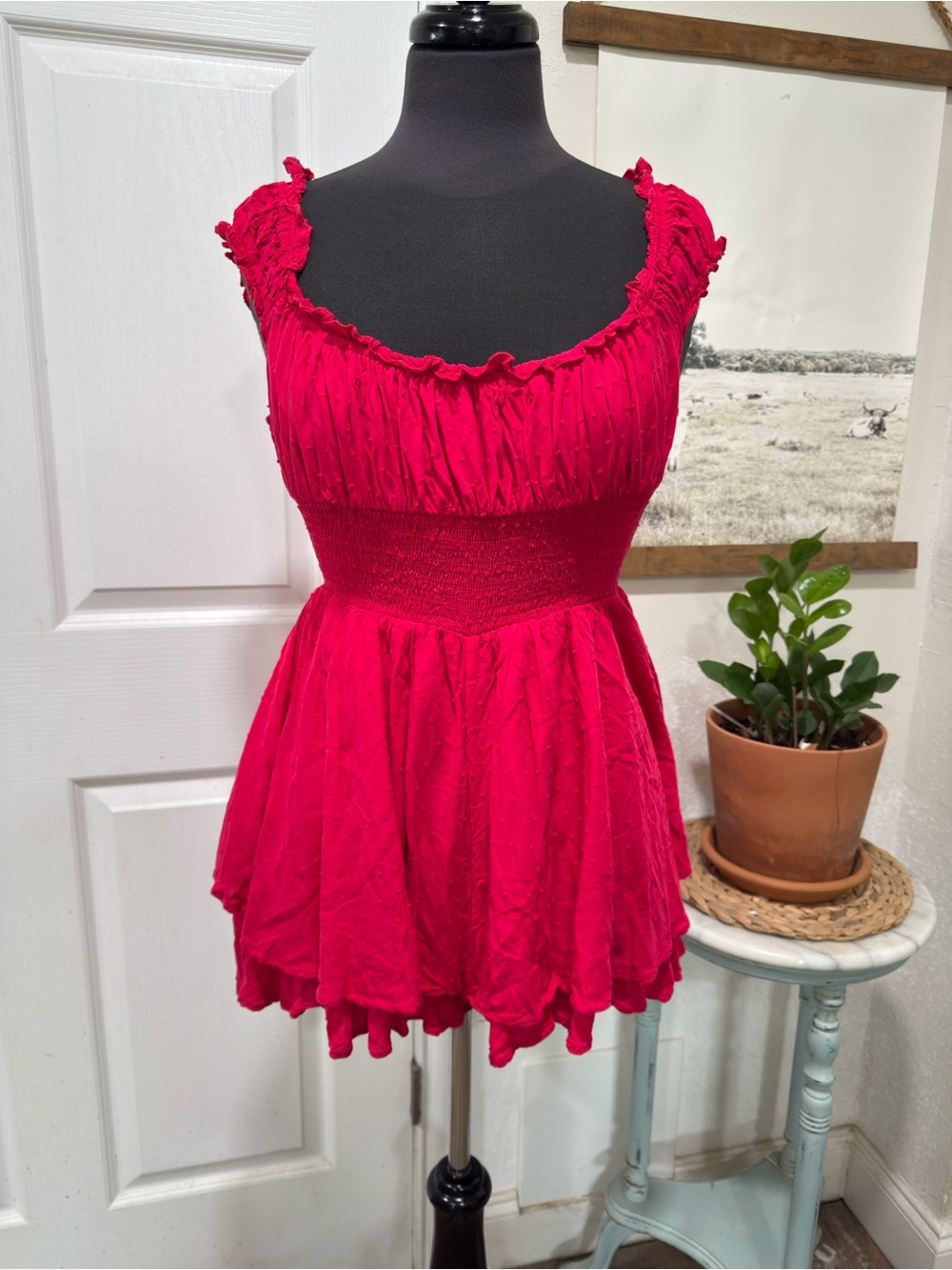 Red Smocked Romper with cinched waist and tiered ruffle skirt